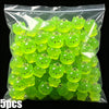 A bag of glow-in-the-dark resin charms shaped like cats and ducks in various shades of lime green.