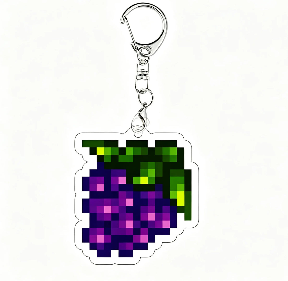 Acrylic keychain charm featuring a vibrant purple and green fruit design