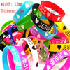 Assortment of silicone bracelets featuring the Jesus heart design in various colors like blue, green, pink, and red.