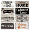 A collection of rustic wooden hanging signs with various typography welcoming people home.