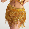A woman wearing a gold sequin hula dancer skirt with long tassels and a matching top.