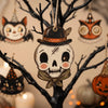 A wooden skull ornament hangs from a dark branch, part of a vintage Halloween decor set.