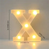 A glowing letter X made of LED lights used for room and party decor