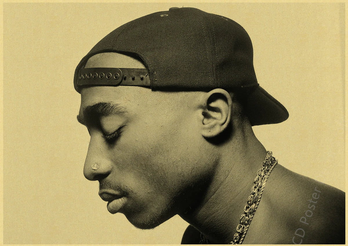 A close-up, sepia-toned portrait of a man wearing a dark cap and a leather band, looking down.