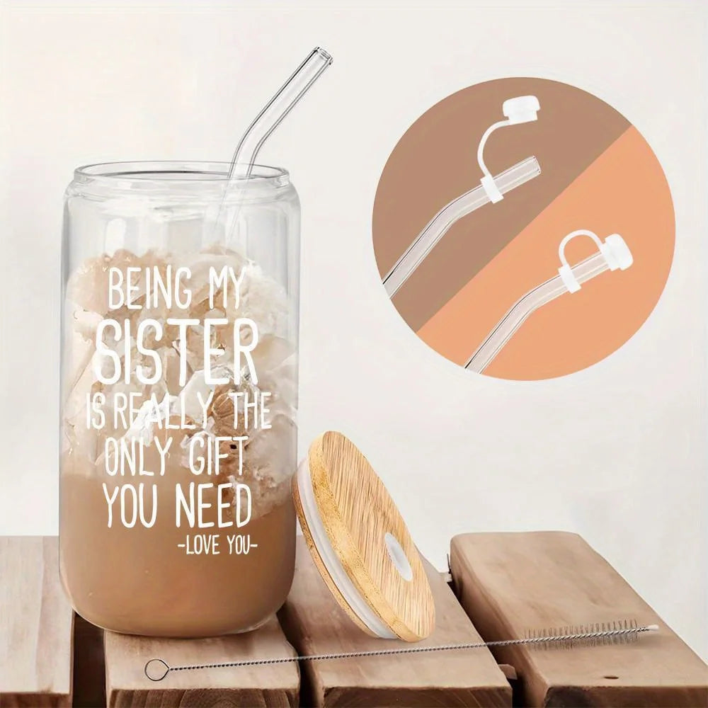 A clear tumbler filled with a light brown beverage and a message that reads Being my sister is really the only gift you need.