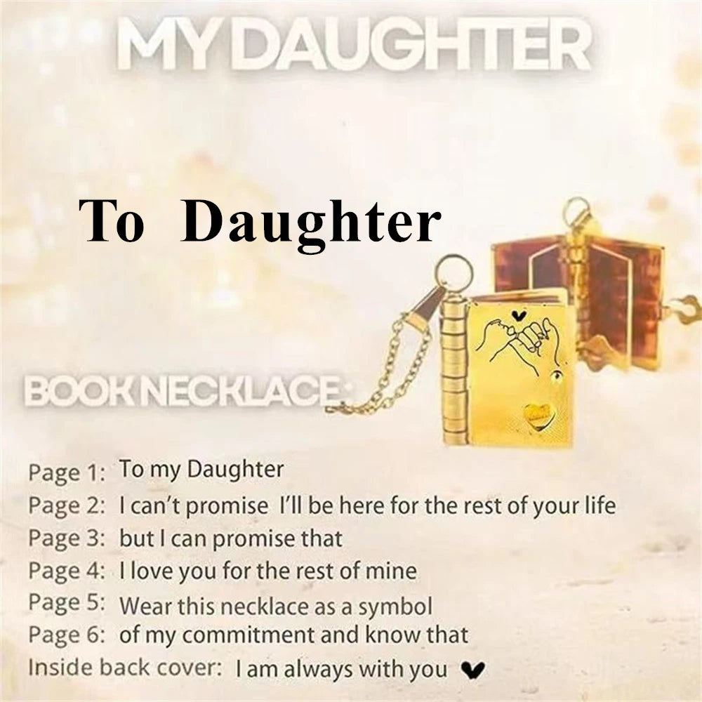 A gold book necklace with an engraved message and a leather bookmark on a light background.