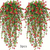 A set of three lifelike faux eucalyptus hanging plants with red flowers and green leaves.