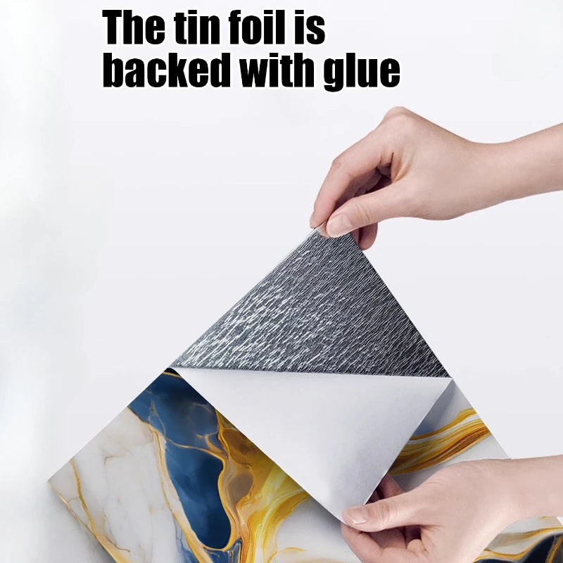 Hands peel back a tin foil backing to reveal a 3D marble effect self-adhesive wall sticker.