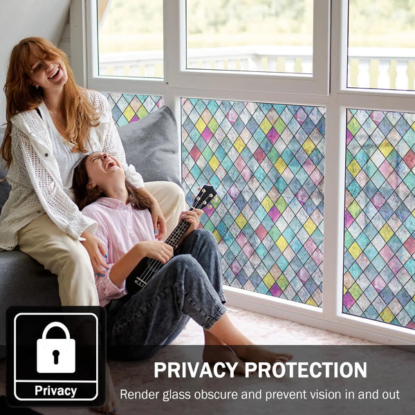 Two people look out of a window featuring rainbow stained glass film for privacy and decoration