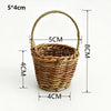 A handwoven rattan storage basket with handles, measuring 5x4cm.