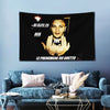 A black banner featuring a portrait of an artist and text, displayed on a light blue wall.