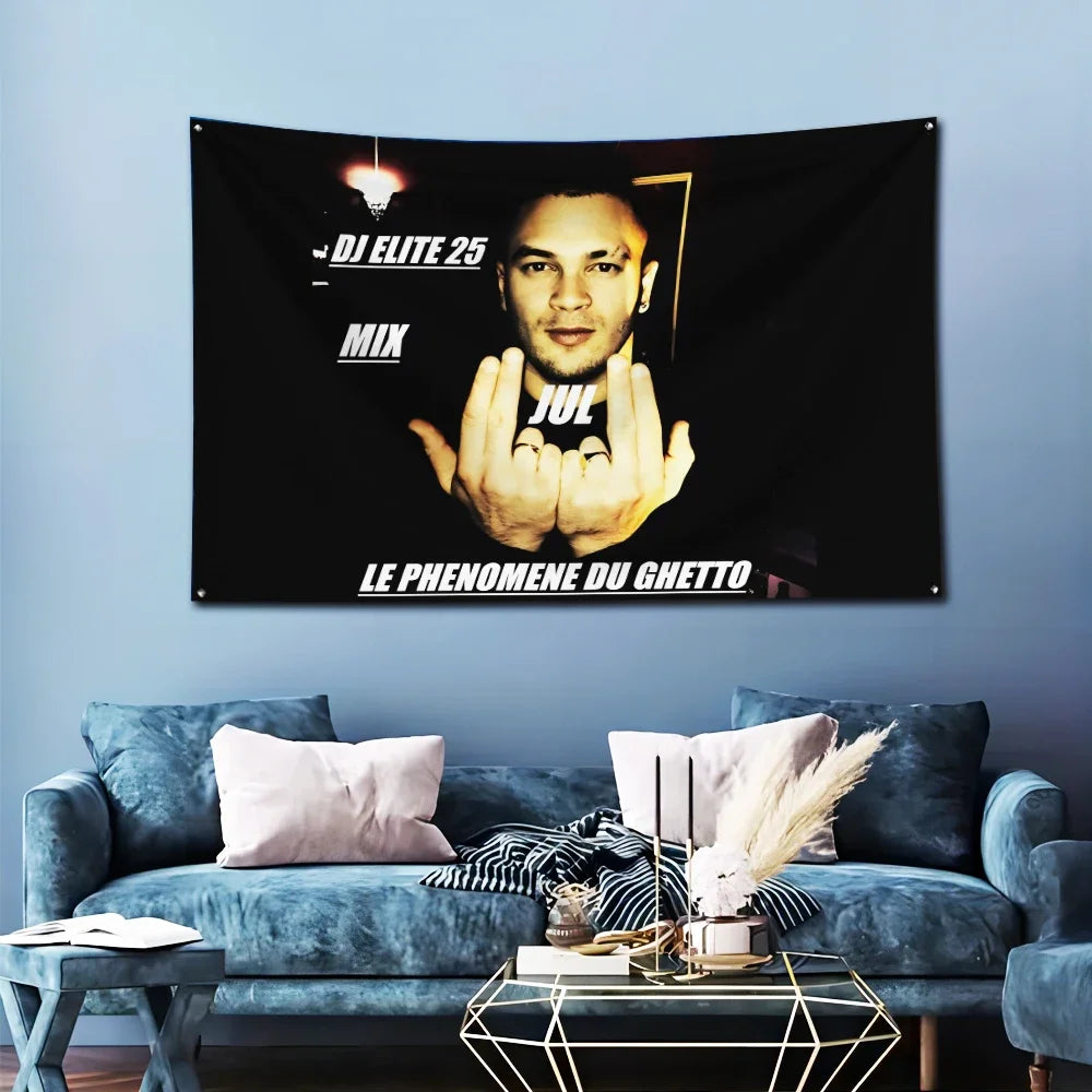 A black banner featuring a portrait of an artist and text, displayed on a light blue wall.