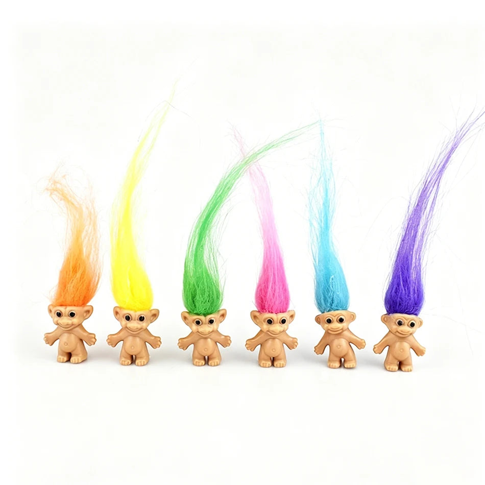 A collection of mini retro troll doll figures in various bright colors including orange, yellow, green, pink, blue, and purpl