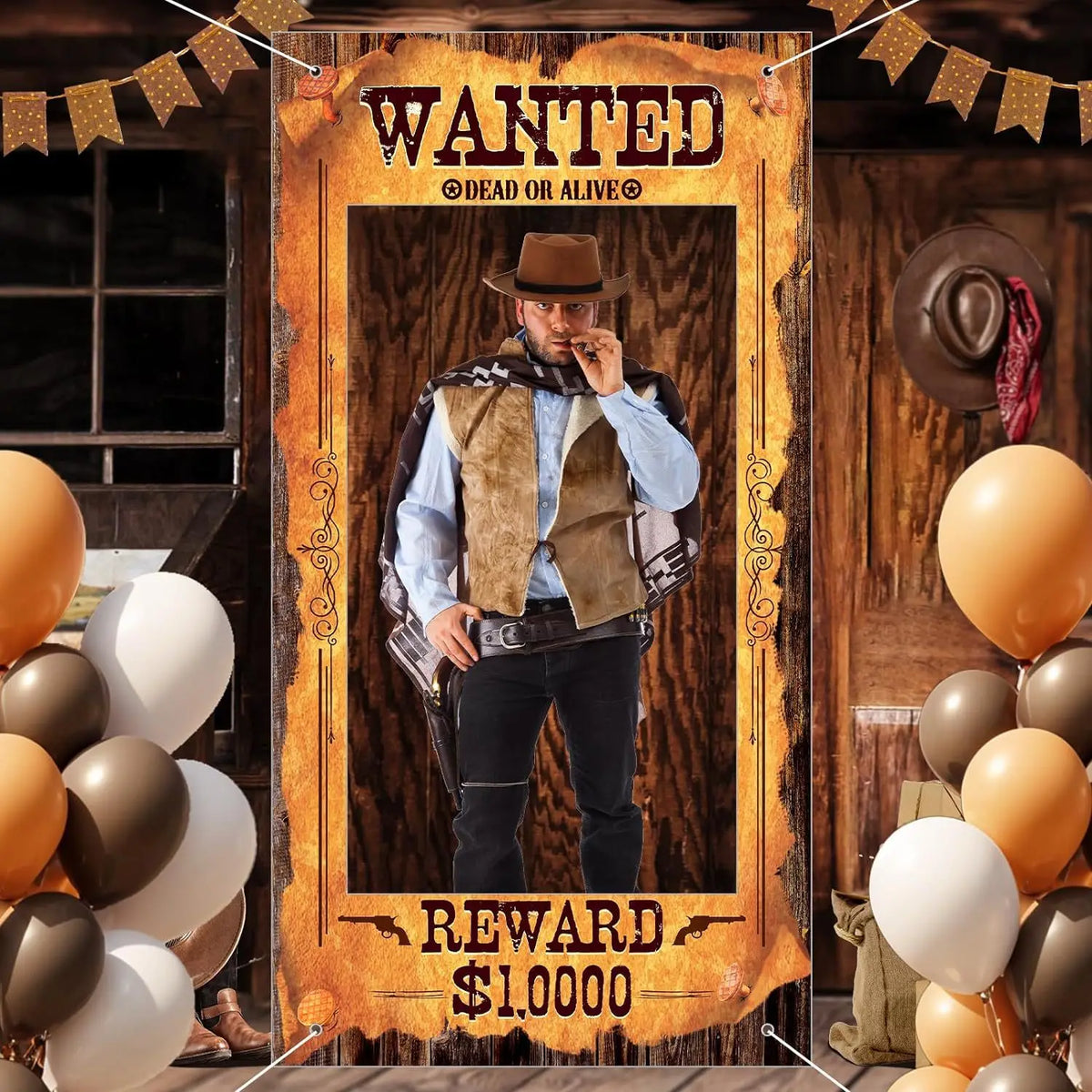 A wooden photo booth backdrop featuring a wanted poster design with a cowboy figure and horse elements.