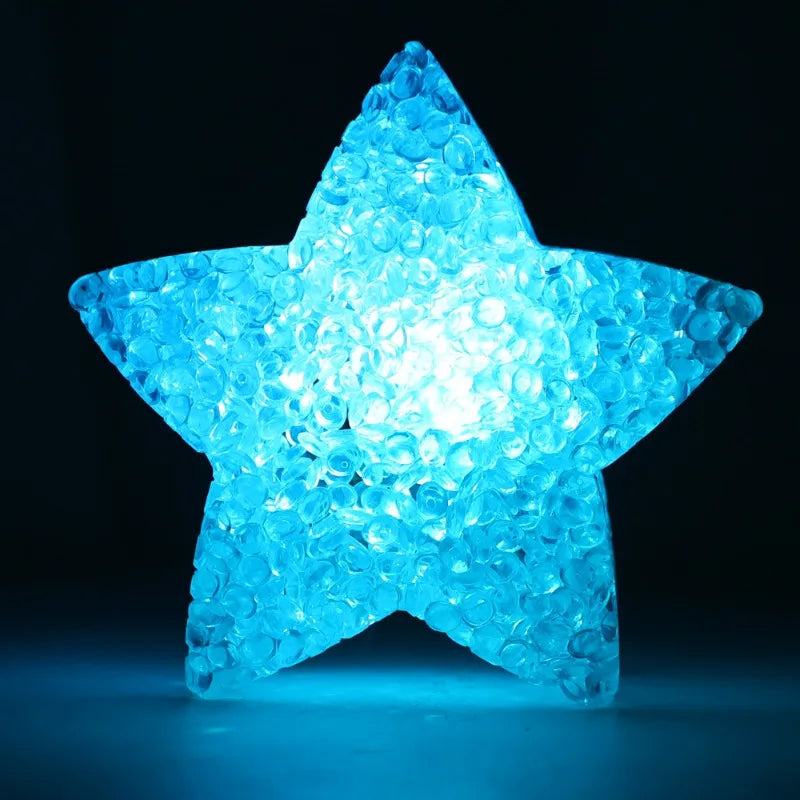 A bright blue star-shaped LED light, designed for dance, stage, and party use.