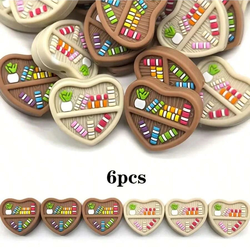 Six pairs of silicone bookshelf beads in various colors and designs for DIY jewelry and crafts