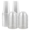 A stack of clear disposable plastic cups with lids for cold drinks.