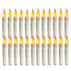 A row of white taper candles with yellow flames, used for flameless LED candles.