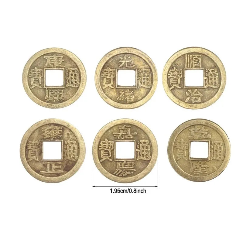 A set of antique Chinese Feng Shui coins for wealth and good fortune, featuring various designs.
