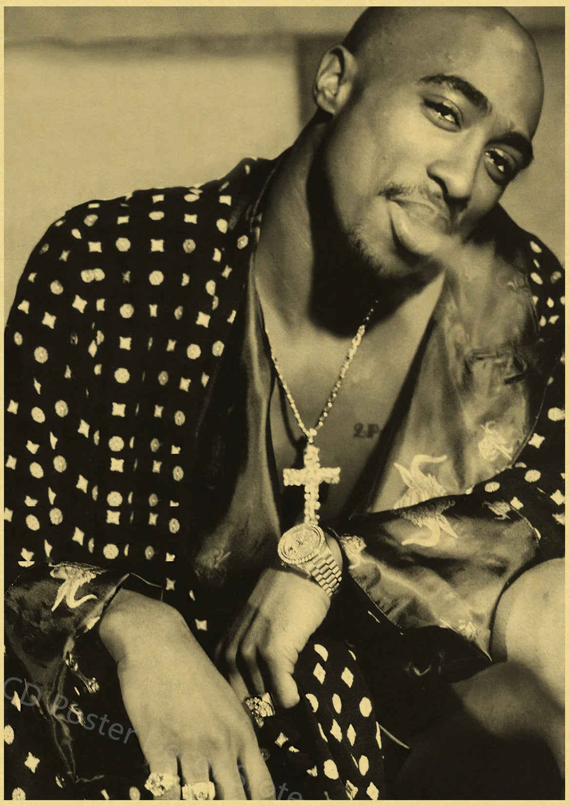 A close-up portrait of a man wearing a patterned shirt and necklace.