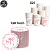 A set of pink and white striped cups and plates with pink bows for a birthday party theme
