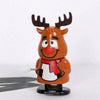 A small, brown clockwork wind-up figurine of a reindeer with antlers and a red scarf.