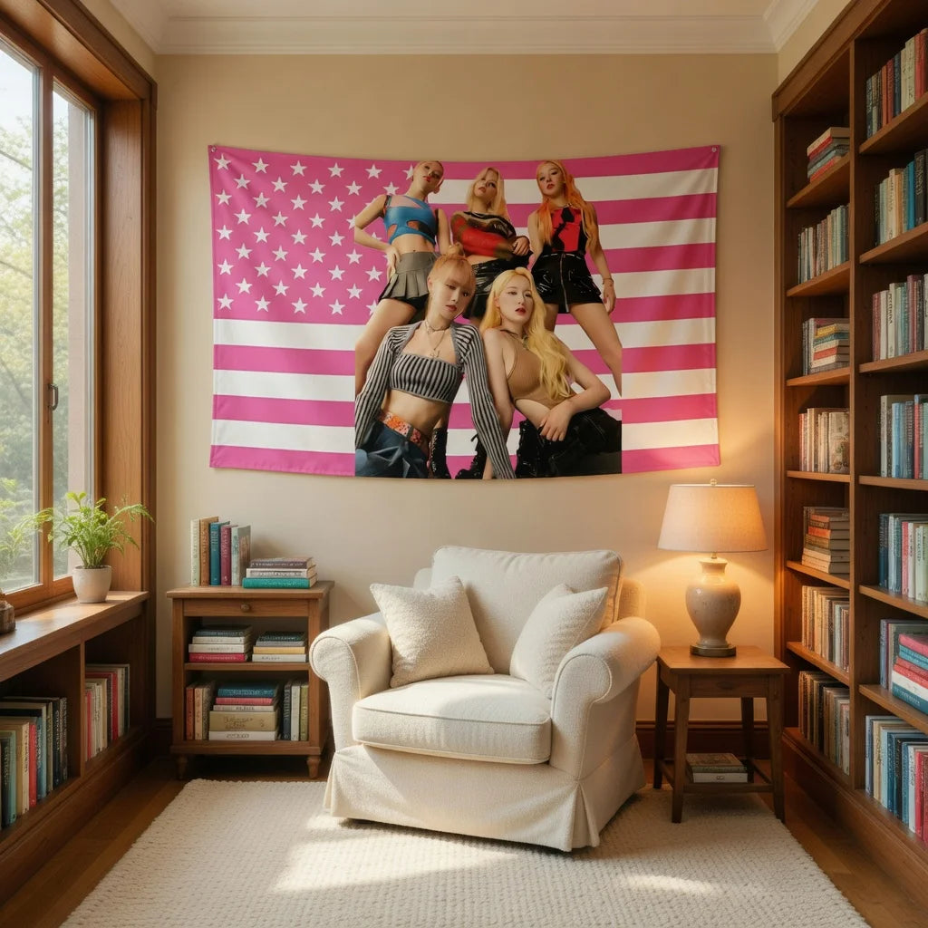 A pink and white striped tapestry featuring K-Pop inspired figures hangs on a wall above a white armchair.