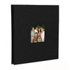 A black linen front scrapbook memory book with a photo of a family.