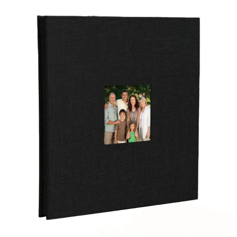 A black linen front scrapbook memory book with a photo of a family.