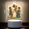 A 3D LED night light featuring a family of Jesus and children in a soft, glowing frame.