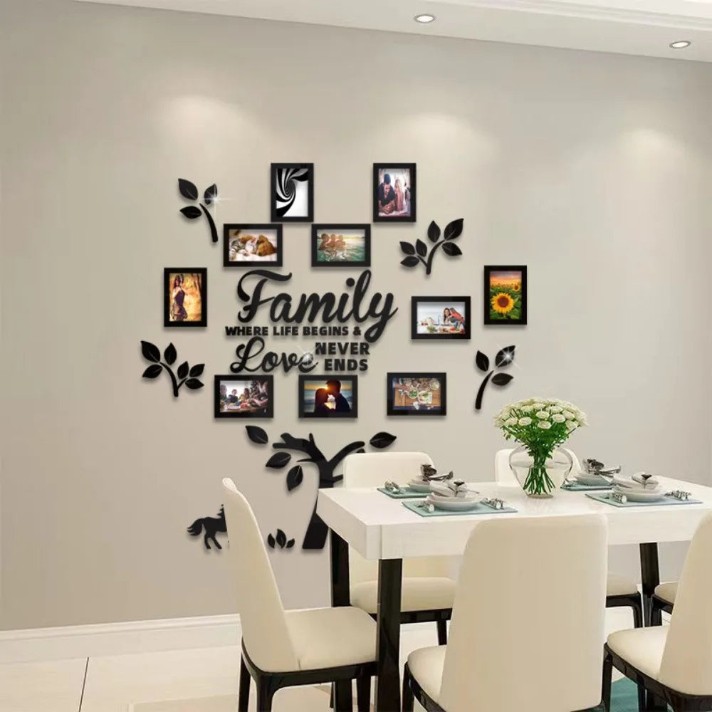 A wall collage featuring framed photos and leaves arranged in the shape of a family tree for a home decor display.