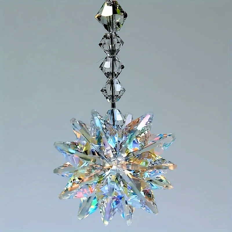 A sparkling crystal star ornament featuring a multifaceted, radiating design suspended from a delicate chain.