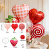 A set of strawberry theme birthday party decorations including a heart balloon, honeycomb, and various ornaments.