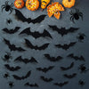 A collection of black bat silhouettes and carved pumpkins for Halloween wall décor