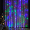 Purple and green fairy lights illuminate a sheer curtain backdrop for events or home decor.