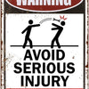 A weathered metal tin sign with a warning about avoiding serious injury and not telling the sign maker how to do their job.