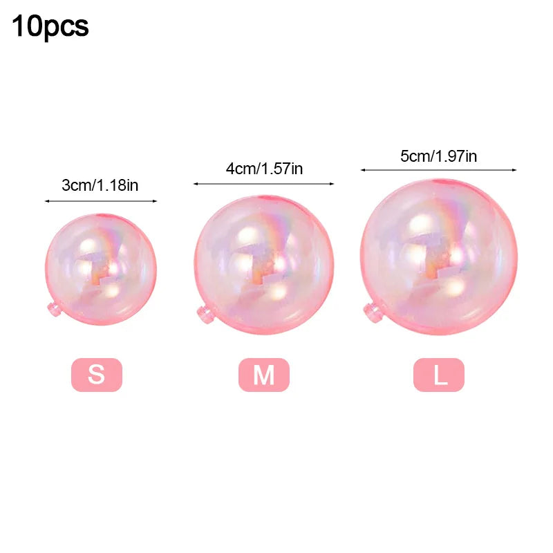 Set of four pink iridescent balloon cake toppers in sizes S, M, and L