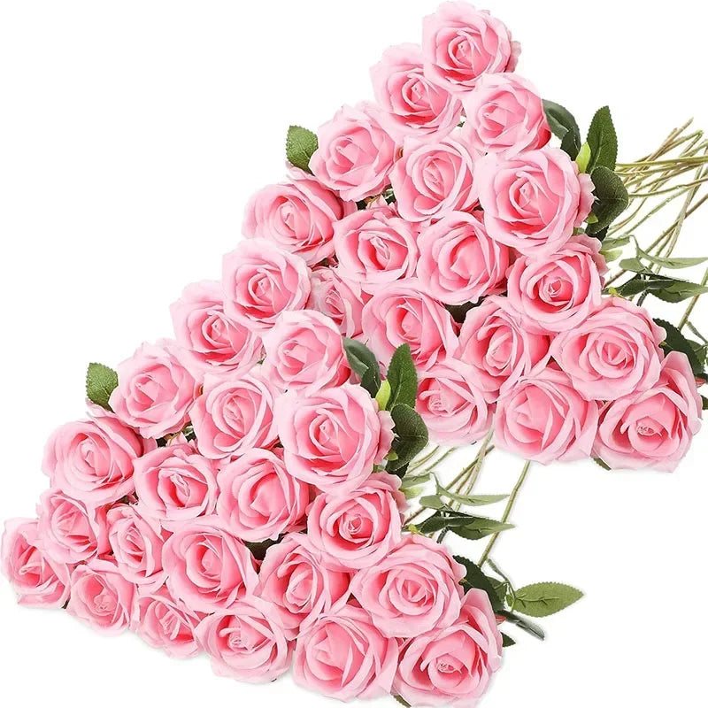 A bouquet of pink velvet artificial roses with green leaves.