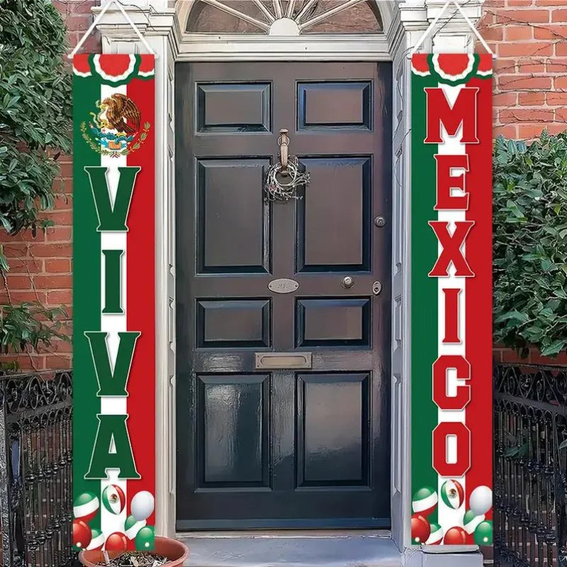 A red and green banner hangs on a door, decorated with Mexican flags and text for Independence Day.