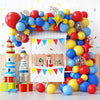 A display of assorted red, yellow, and blue latex party balloons for celebrations.