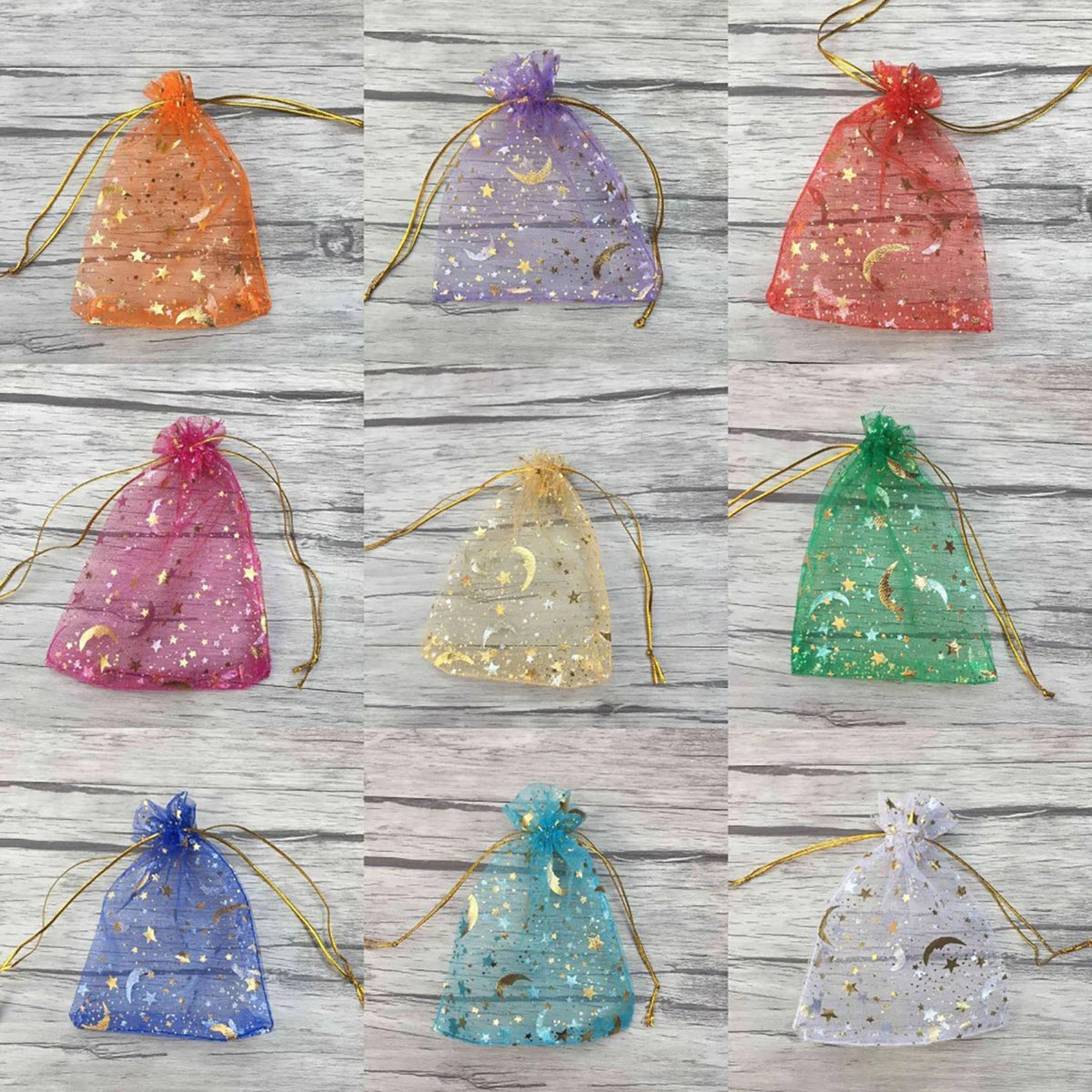A collection of decorative organza drawstring bags featuring moon and star patterns in various colors like orange, purple, pi