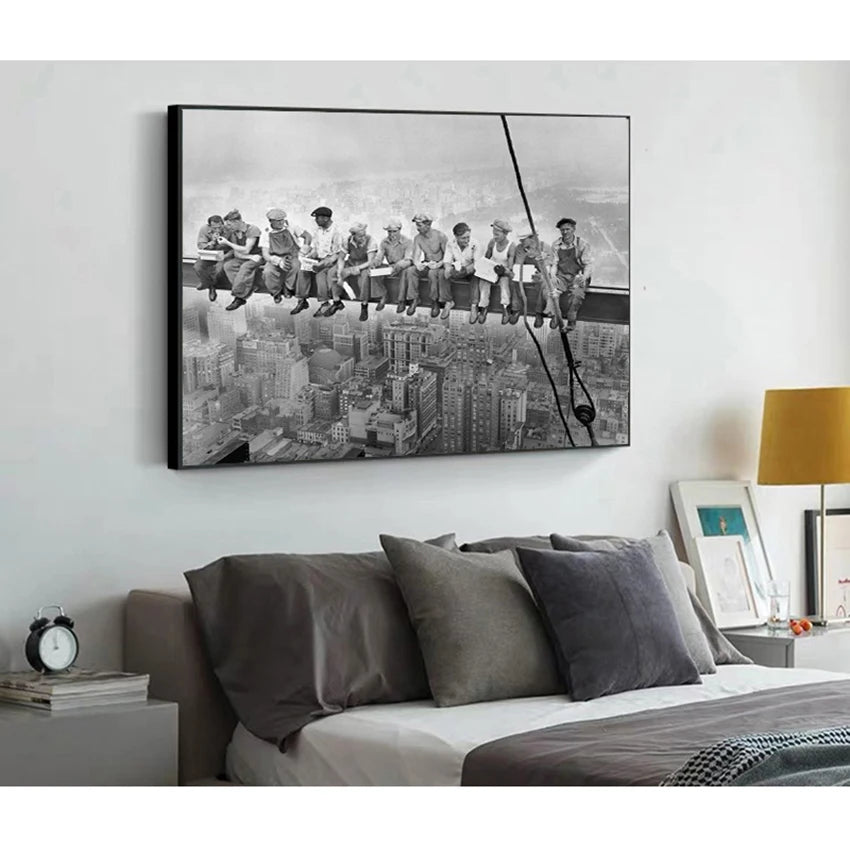 Black and white canvas wall art depicting a group of people standing on a ledge overlooking a New York City skyline.