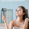 A woman is using a Superwind device, which utilizes technology from a high-speed blower, for cooling.