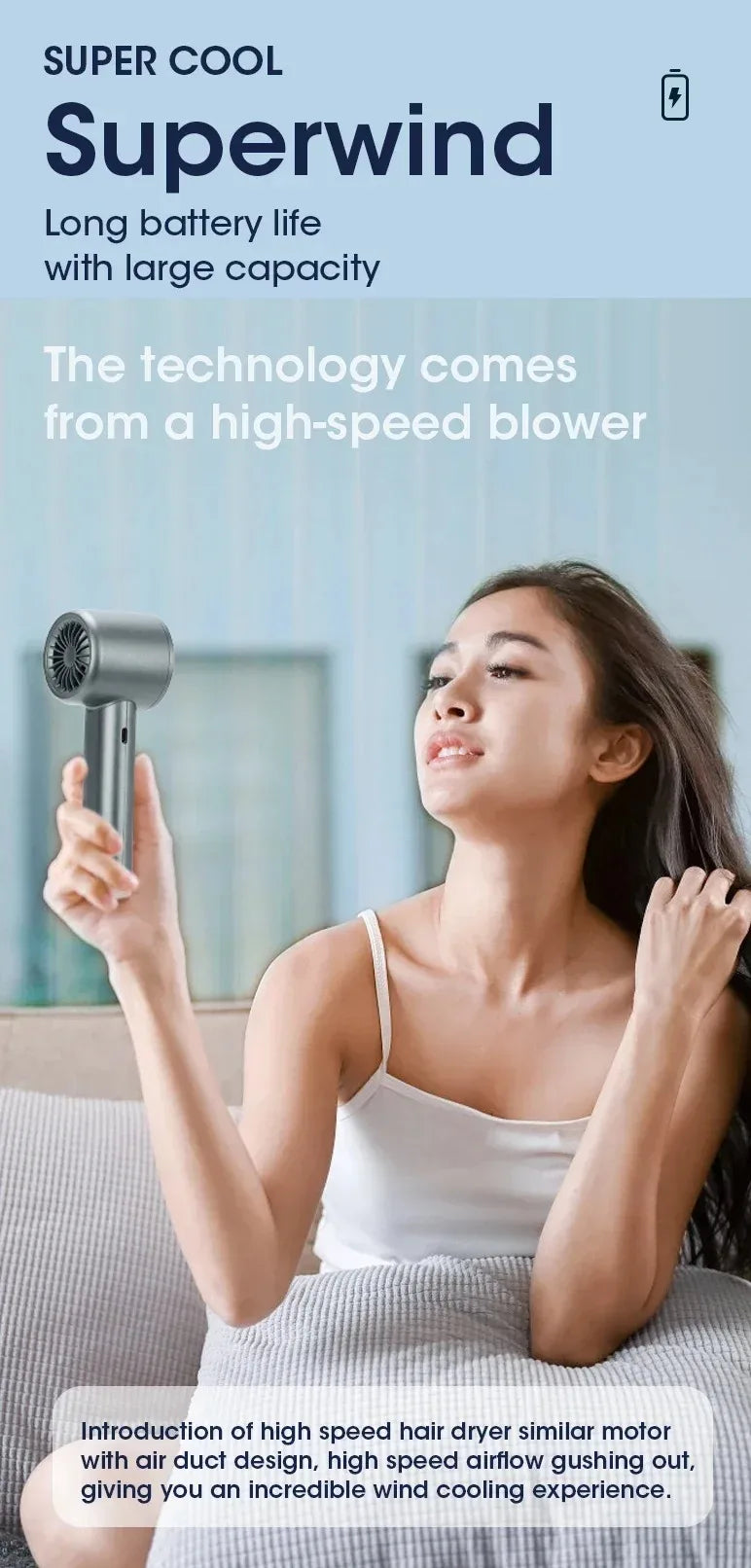 A woman is using a Superwind device, which utilizes technology from a high-speed blower, for cooling.