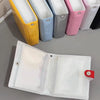 A set of colorful mini photo card binders in yellow, blue, gray, and pink, next to a clear plastic binder.
