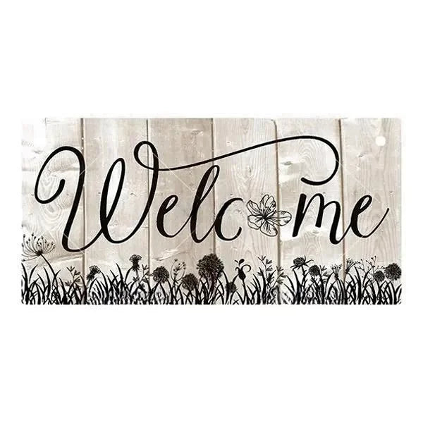 Rustic wooden hanging sign with black script text that reads Welcome me set against a background of vertical weathered wood p