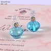 Two small glass bottles filled with blue liquid resin for dollhouse decor