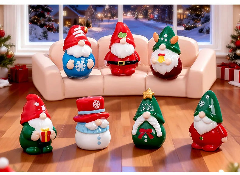 A festive resin Christmas dwarf figurine set featuring Santa and reindeer figures displayed on a pink sofa with a snowy winte