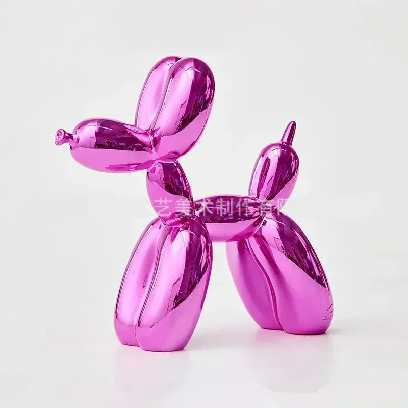 A pink resin balloon dog sculpture with a whimsical design used for home and office decor.