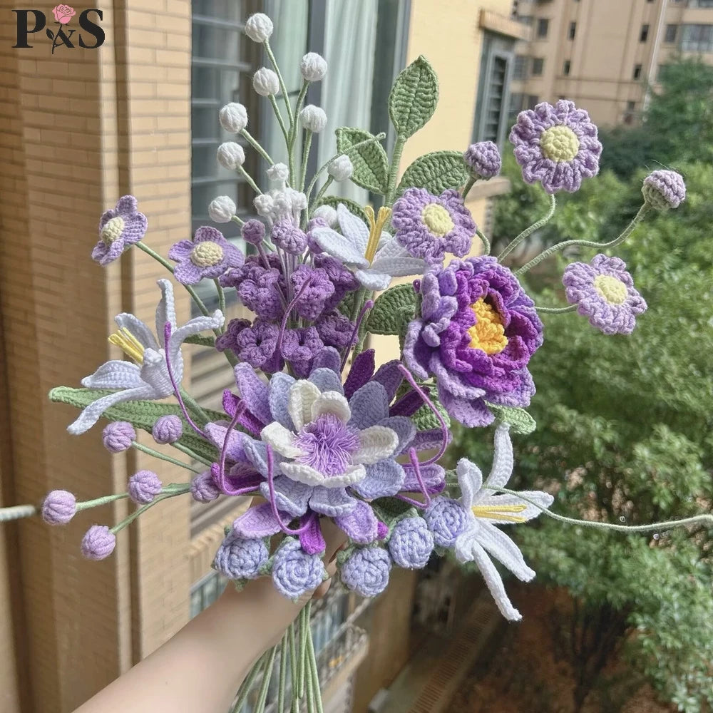 A handmade crochet flower bouquet featuring purple, lavender, and white flowers.